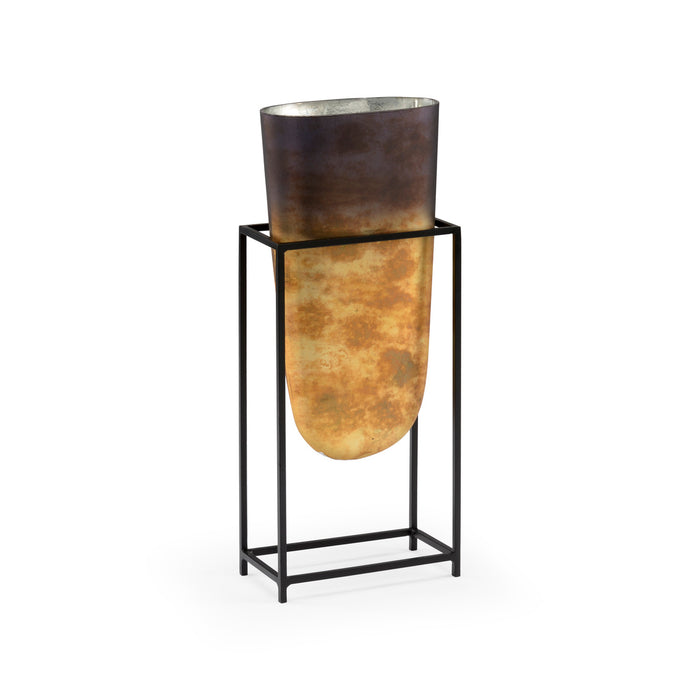 Decorative vase with a black metal stand on a white background