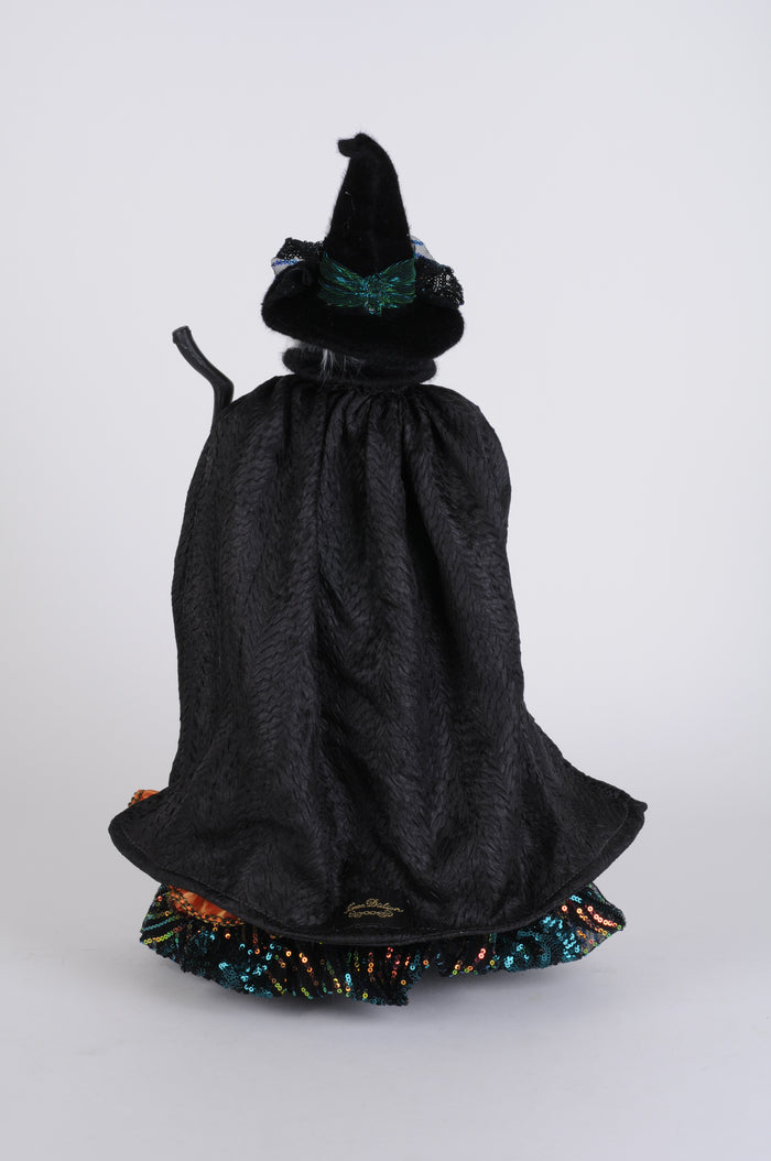 Black dress with colorful trim on a white background