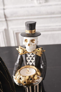 Design Shop 13 Inch Black and Gold Skeleton Holding Gold Jack O Lantern Pumpkin