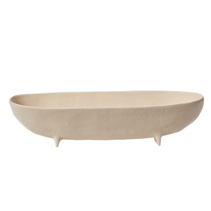 Beige ceramic bowl with three small feet on a white background