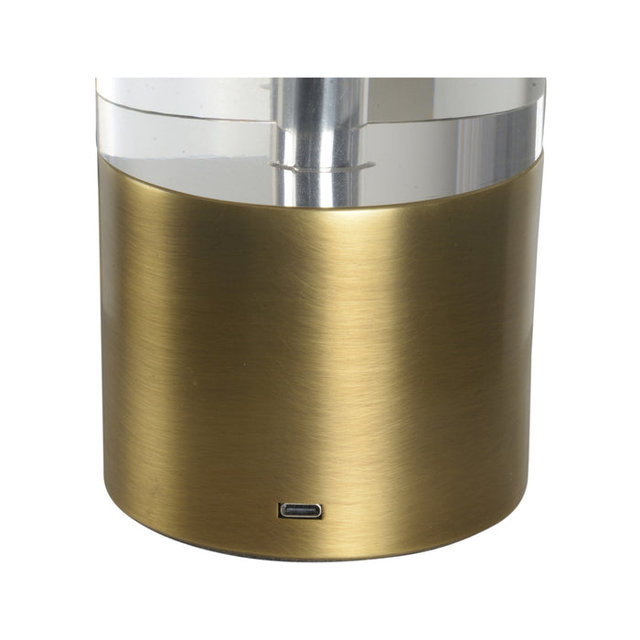 Gold cylindrical container with a clear lid on a white background