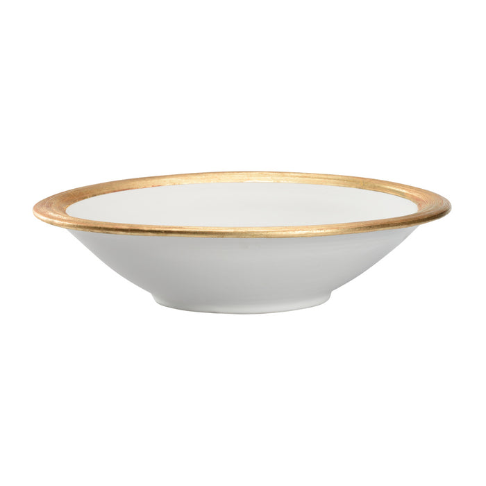 White bowl with gold rim on a white background