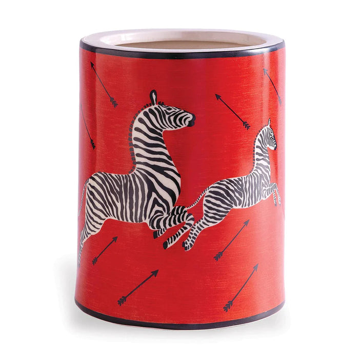 Red cylindrical container with zebra design on a white background