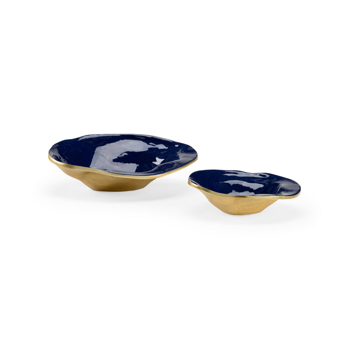 Two blue ceramic bowls with gold bases on a white background