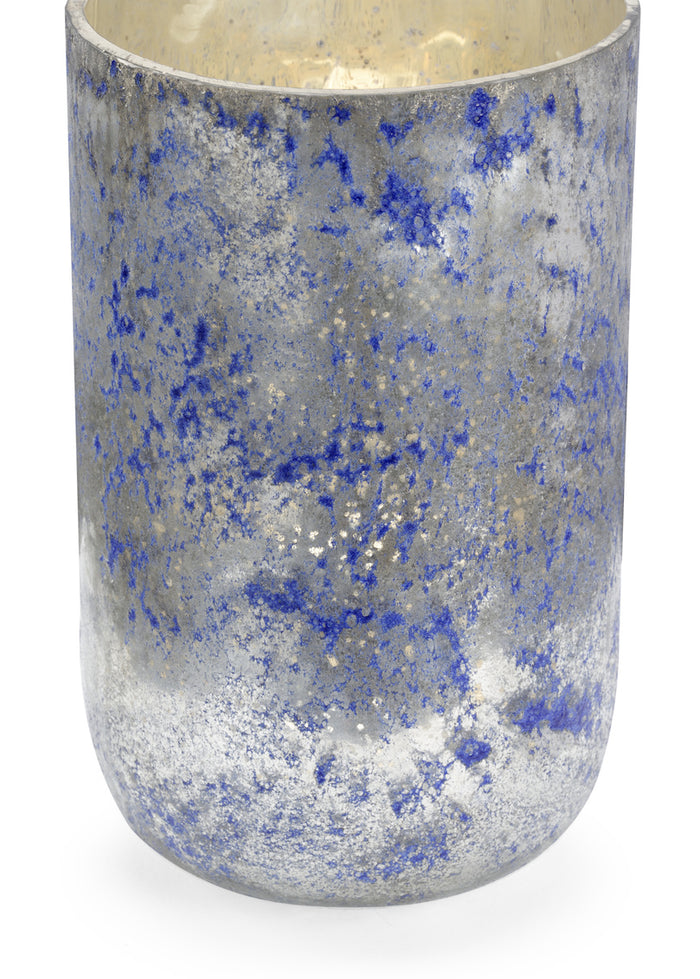 Decorative candle holder with blue and silver speckled pattern on a white background