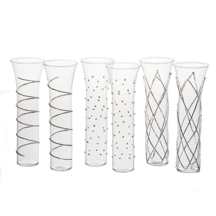 Set of six clear glass vases with decorative patterns on a white background