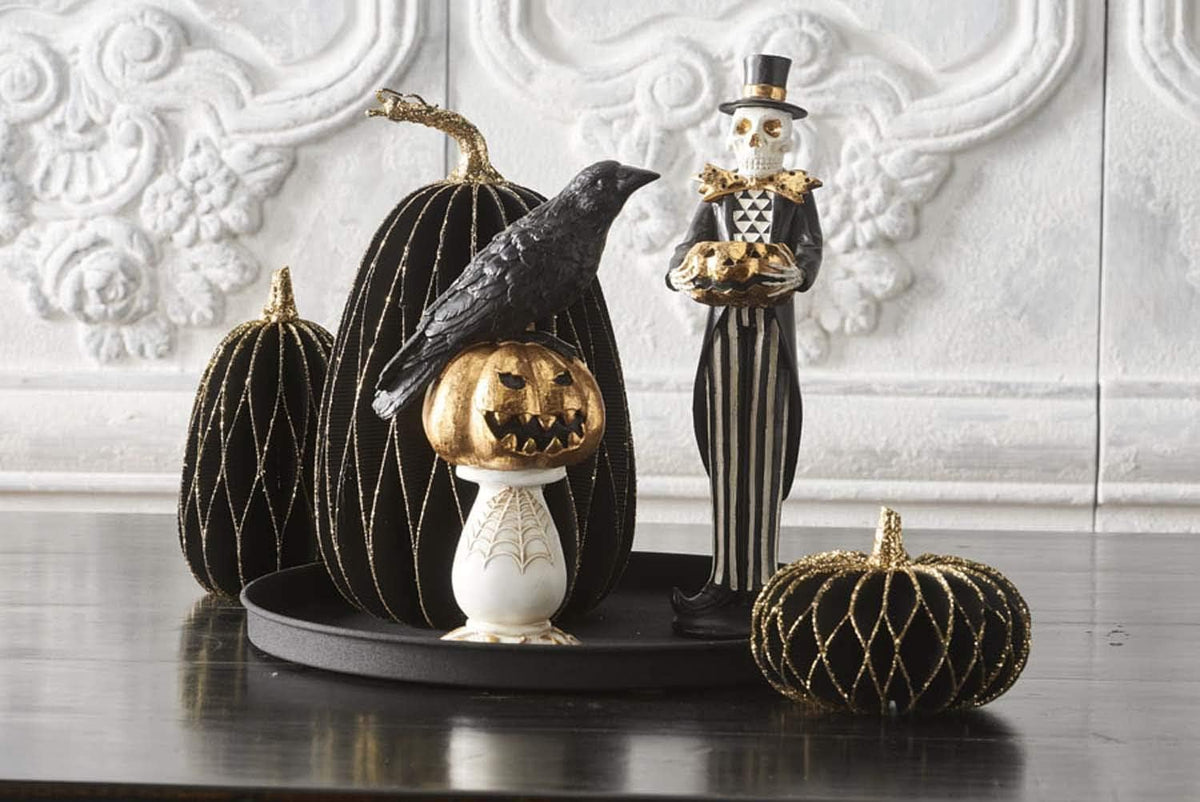 Design Shop 13 Inch Black and Gold Skeleton Holding Gold Jack O Lantern Pumpkin