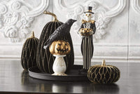 Design Shop 13 Inch Black and Gold Skeleton Holding Gold Jack O Lantern Pumpkin