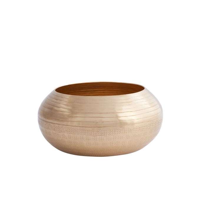 Gold-colored bowl with textured surface on a white background