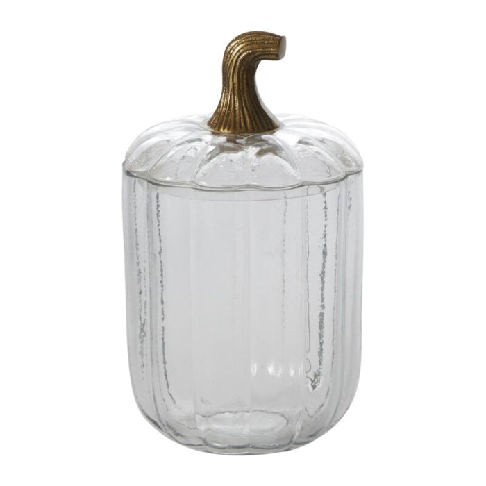 Clear glass pumpkin with a gold stem on a white background