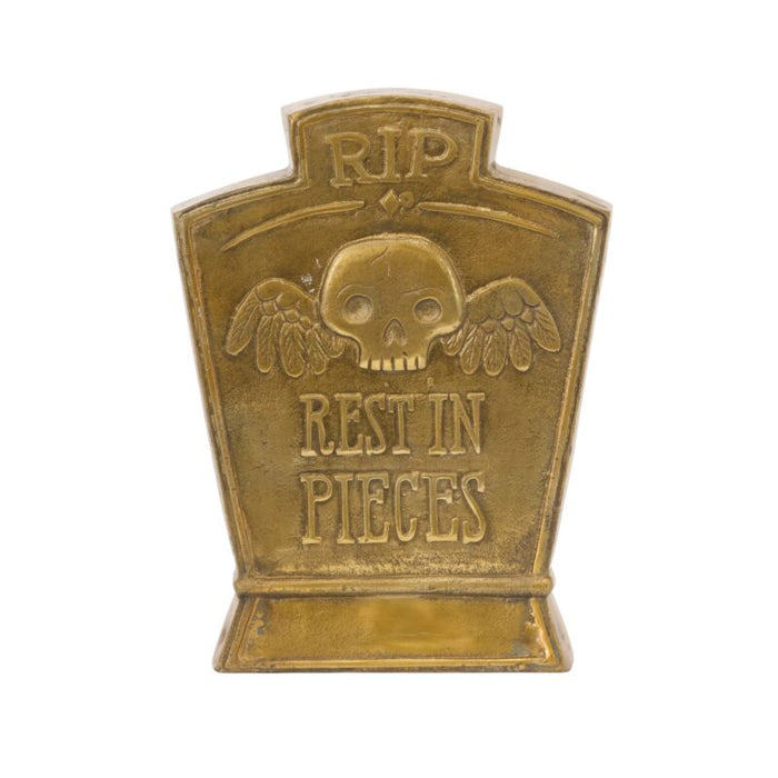 Bronze tombstone with skull design and 'RIP Rest in Pieces' text on a white background