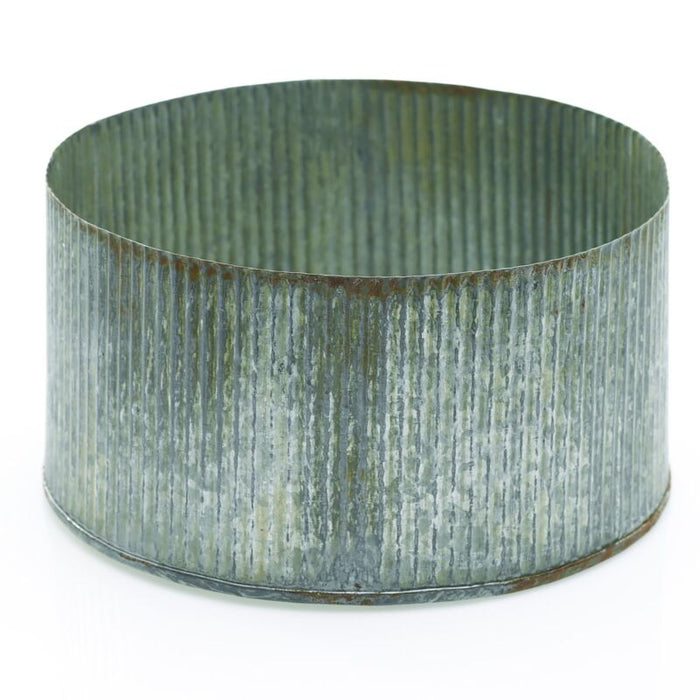 A silver metal bowl with a ribbed texture from the Design Shop Norah Collection.