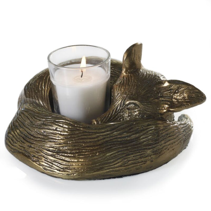 Decorative candle holder shaped like a tortoise with a candle inside on a white background