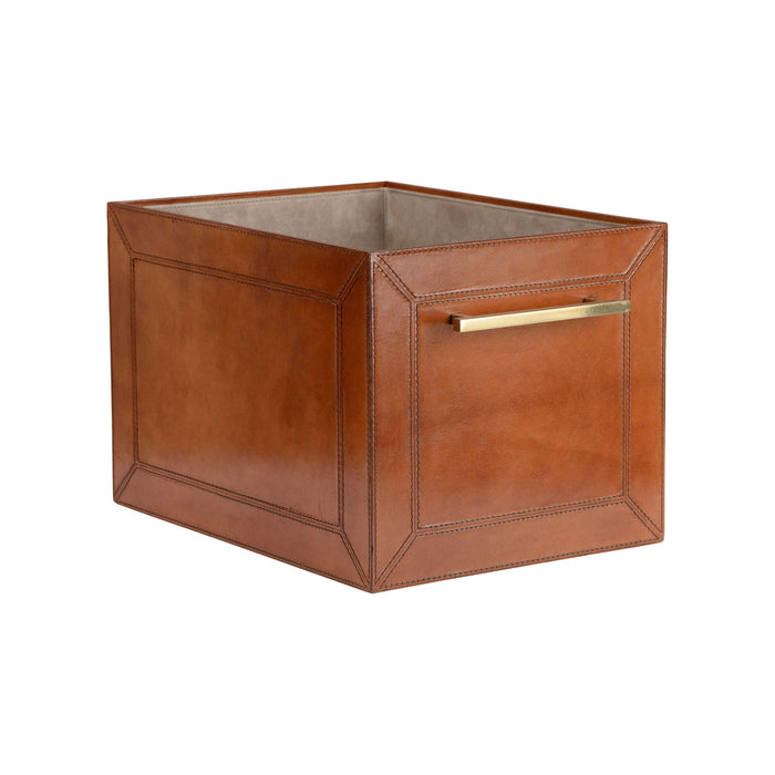 Brown leather cube with a gold handle on a white background