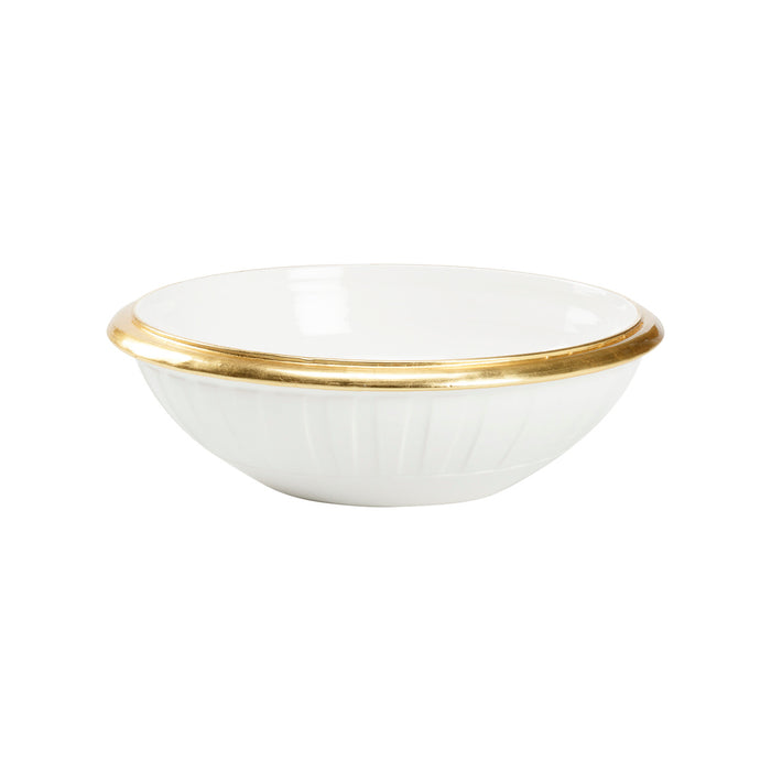 White bowl with gold rim on a white background