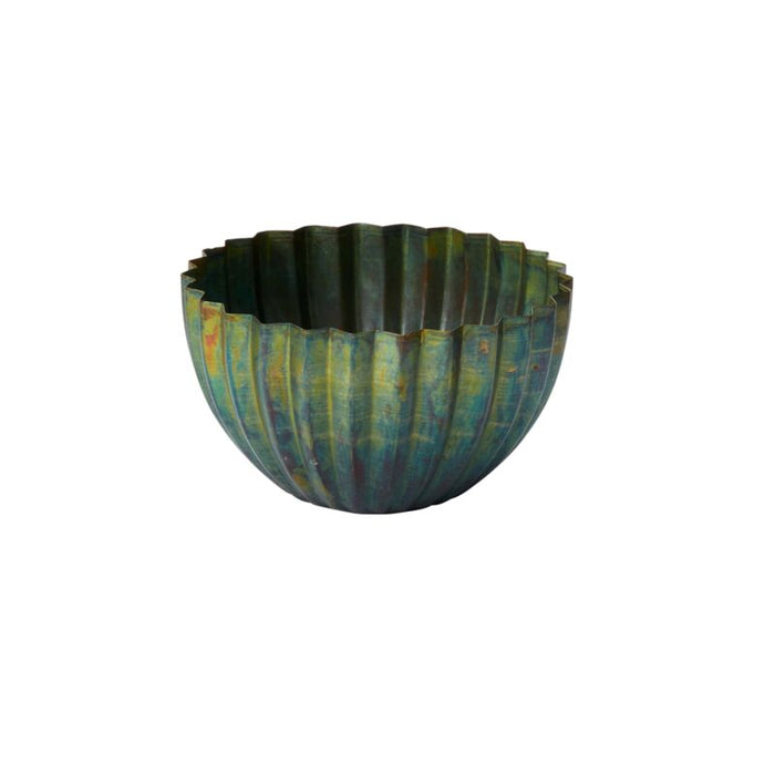 Decorative bowl with ribbed texture on a white background