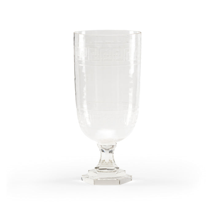 Clear glass goblet on a white background