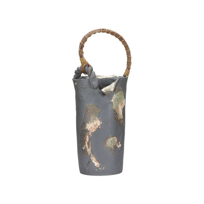 Gray ceramic bucket with gold leaf patterns and a woven handle on a white background