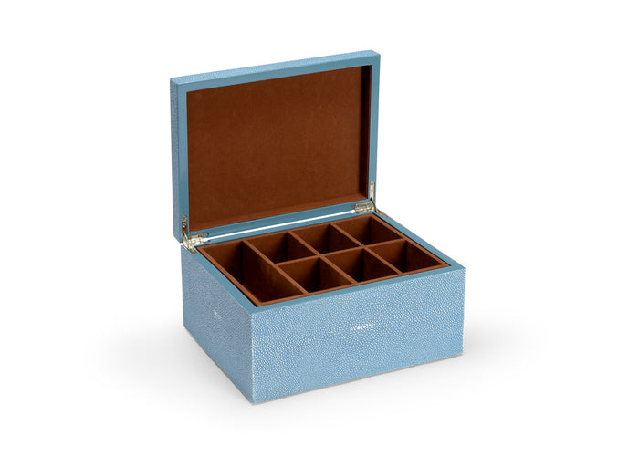 Blue jewelry box with brown interior on a white background
