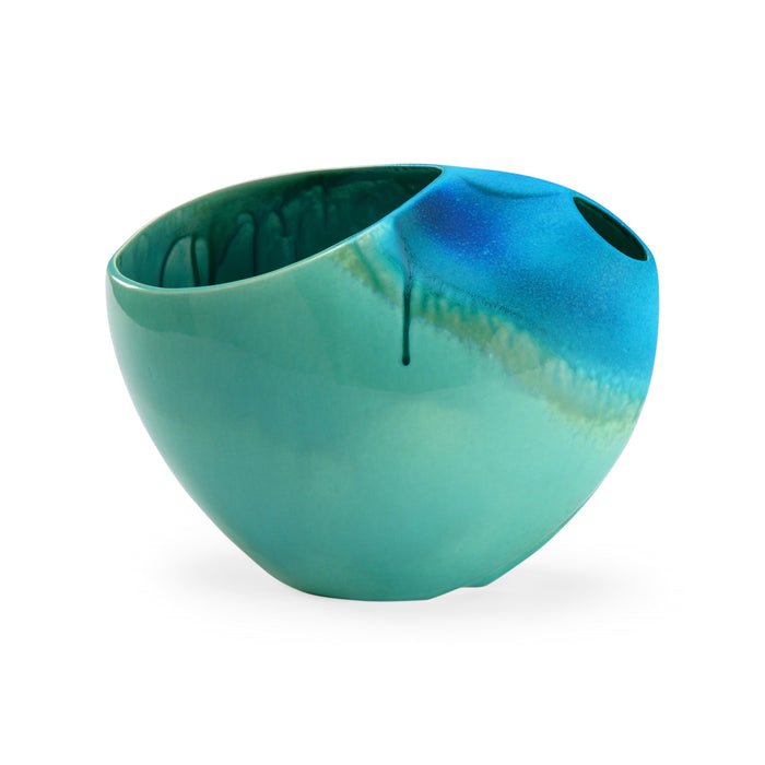 Green ceramic bowl with a gradient effect on a white background