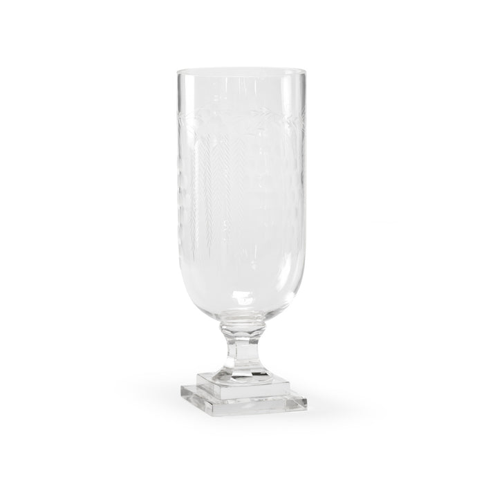 Clear glass vase with a square base on a white background