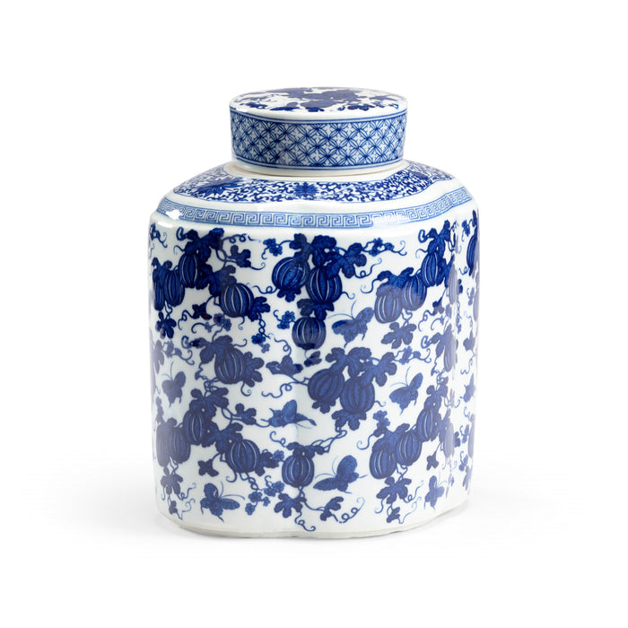 Blue and white ceramic jar with intricate patterns on a white background