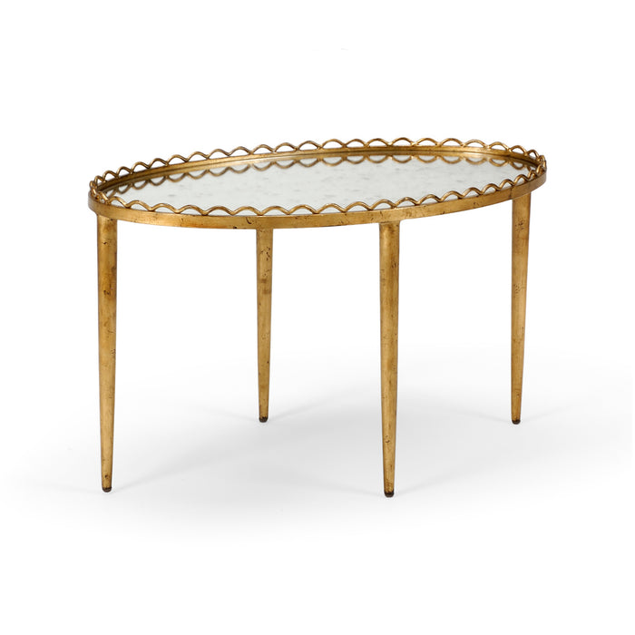 Gold-framed glass-top table on a white background