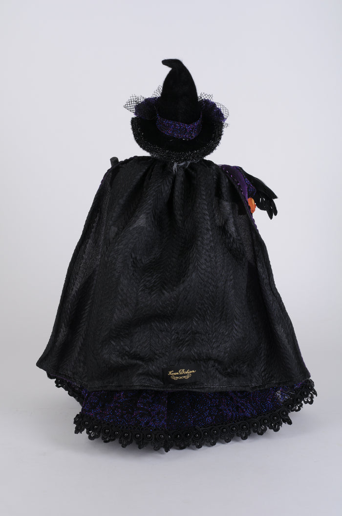 Black fabric bag with decorative elements on a white background