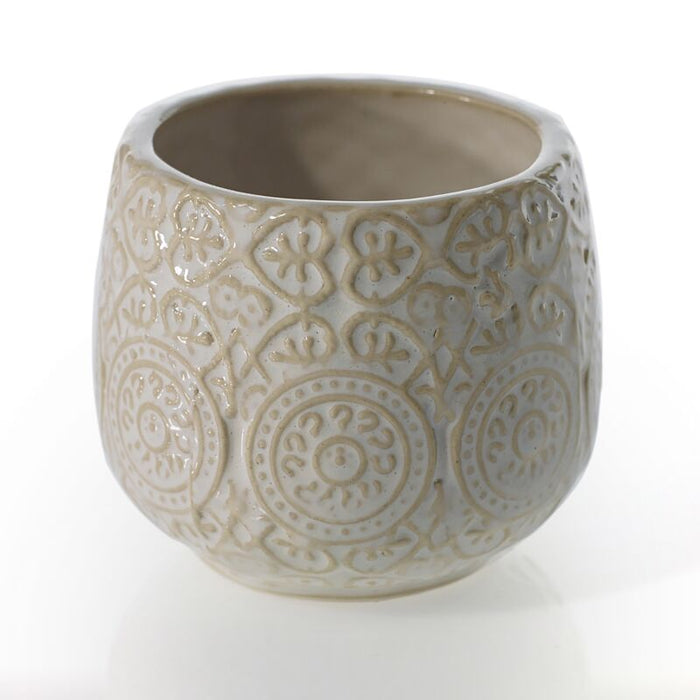 Decorative ceramic pot with intricate patterns on a white background