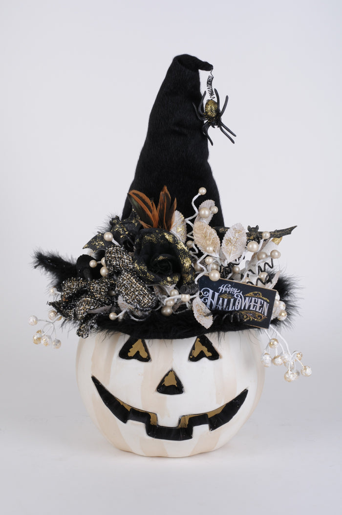 Halloween-themed decorative pumpkin with a witch hat and decorative elements on a white background