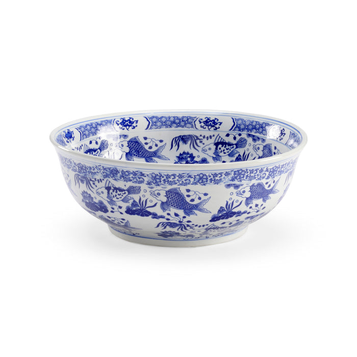 Blue and white ceramic bowl with intricate patterns on a white background
