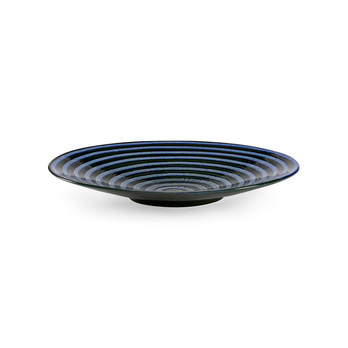 Ceramic plate with blue striped design on a white background
