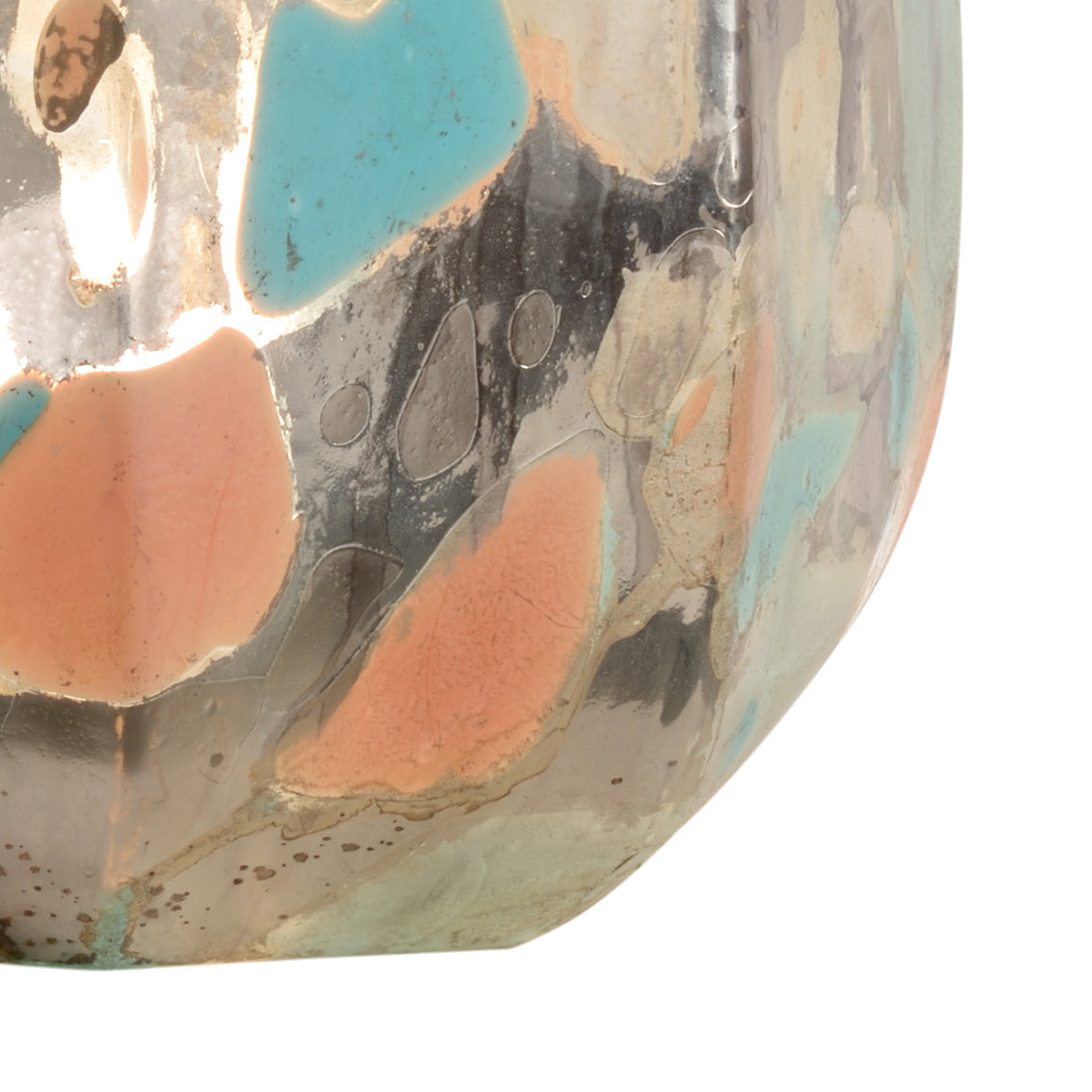Close-up of a decorative ceramic bowl with multicolored glaze on a white background
