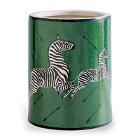 A green porcelain ice bucket with a white zebra pattern and black stripes, along with directional arrows.