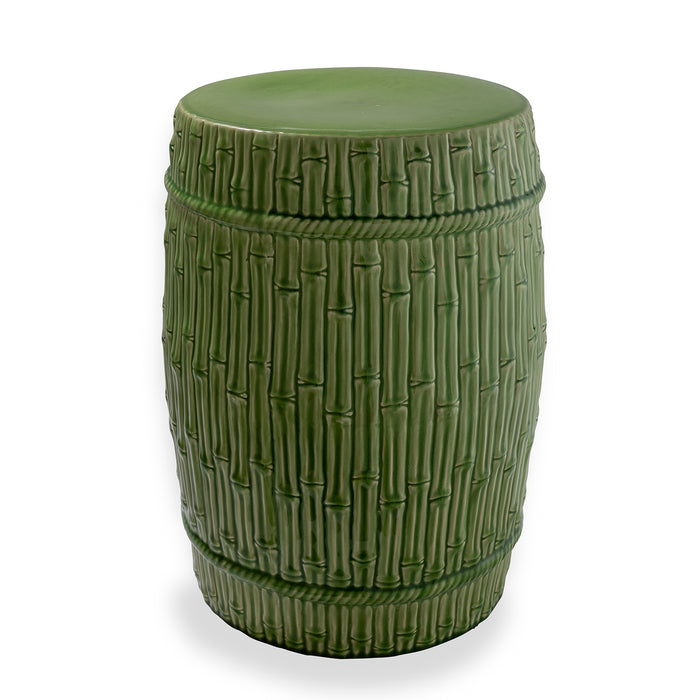 A porcelain garden stool with a carved bamboo design in an apple green color.