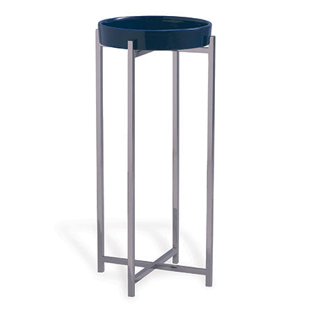 A navy blue porcelain tray on a nickel polished solid steel accent table.