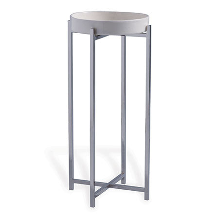A contemporary accent table with a cream-colored porcelain tray top and a nickel polished steel base.