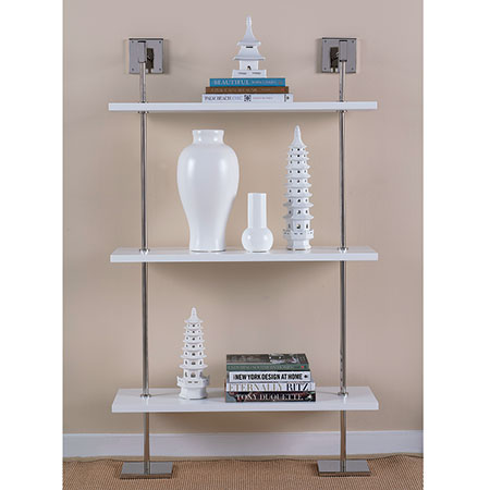 A modern multi-tier shelf with polished nickel hardware and white lacquer shelves, displaying various decorative items like vases and books.