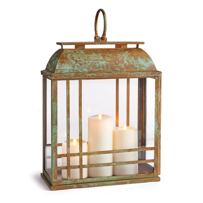 A brown, metal lantern with a glass enclosure displaying candles with an open, vented design.