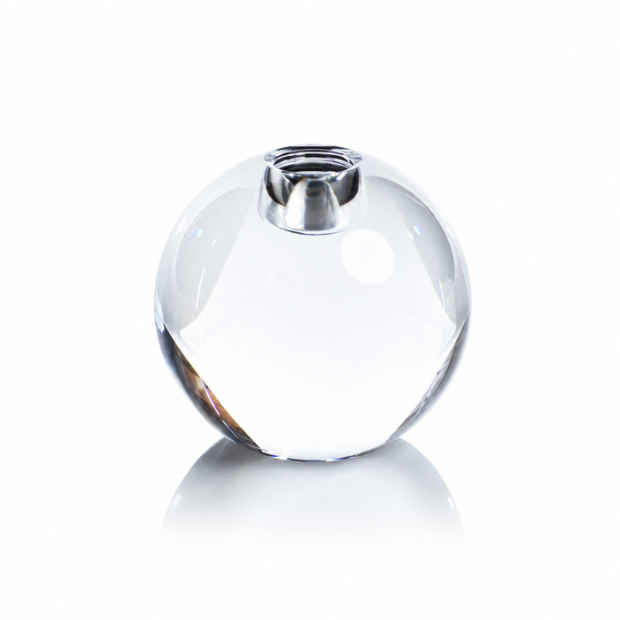 Clear glass bead with silver top on a white background