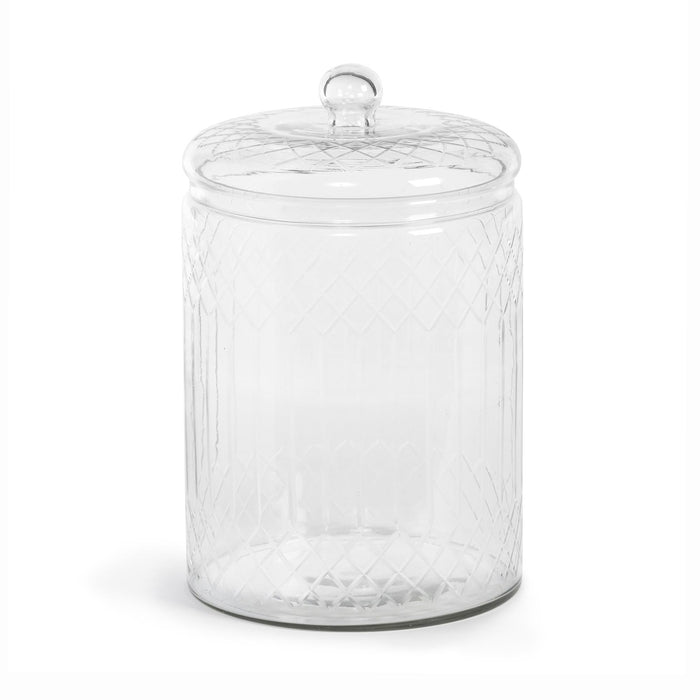 Clear glass jar with textured surface and lid on a white background