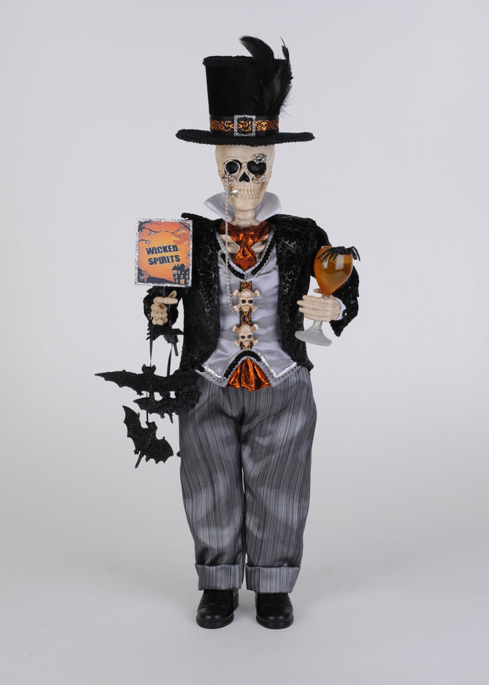 Skeleton figure in a top hat and suit holding a book and glass on a white background