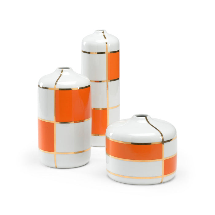 Three ceramic containers with orange and gold checkered patterns on a white background