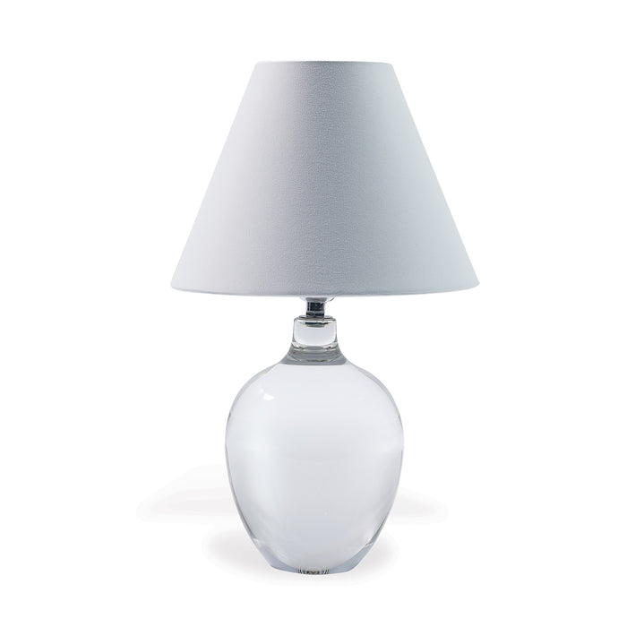 A crystal table lamp with a tapered white shade, featuring a clear base and nickel hardware.