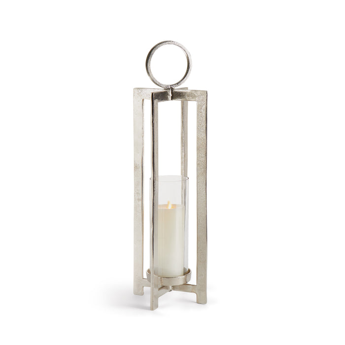 A silver aluminum lantern with a glass candle holder, featuring a large round handle and a footed detail.