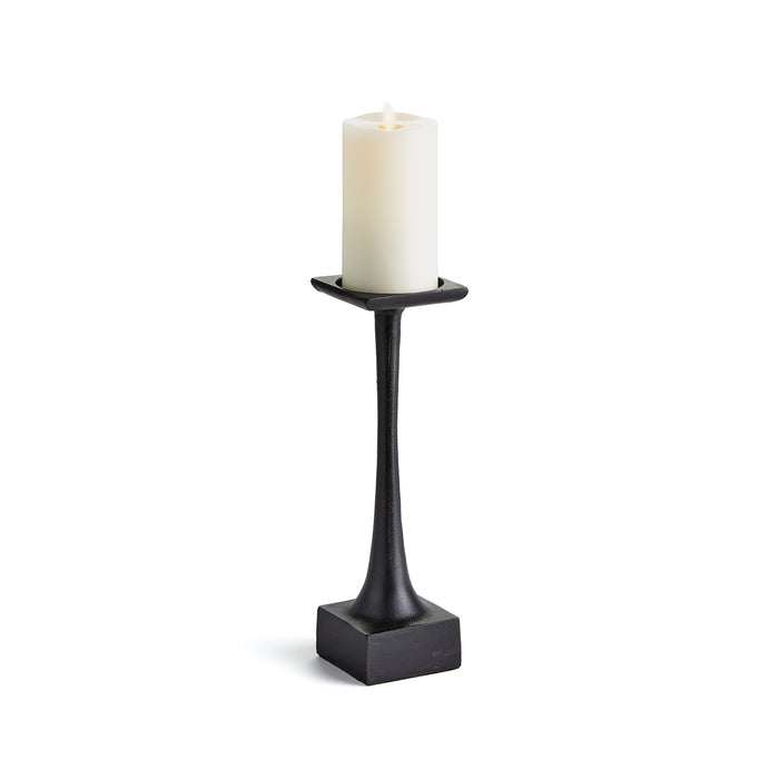 A black candle stand with a weighted base and a tall slender body, designed to hold a candle.