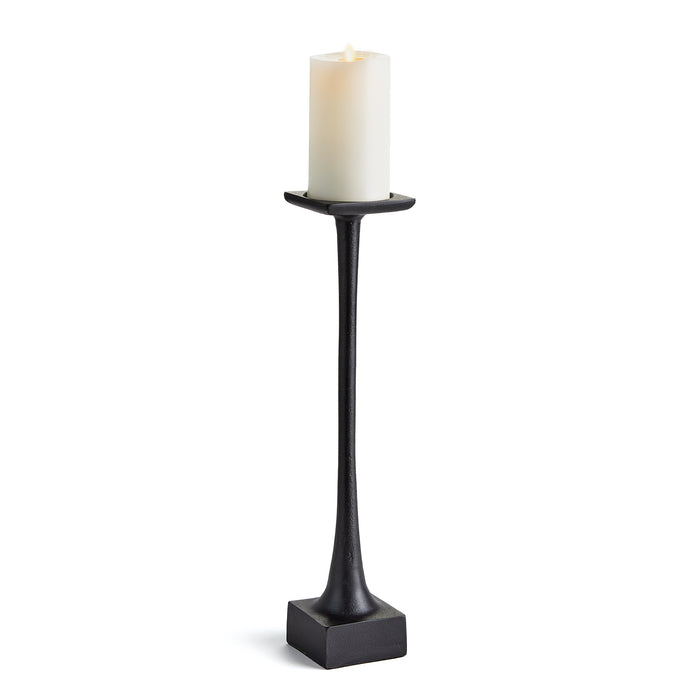 A tall black candle stand with a weighted base and a slender body, designed to hold a candle.