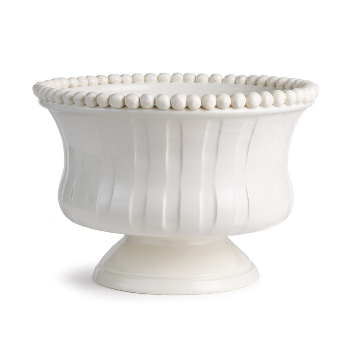 Cream ceramic decorative footed bowl with fluted sides and a beaded rim on a pedestal base.