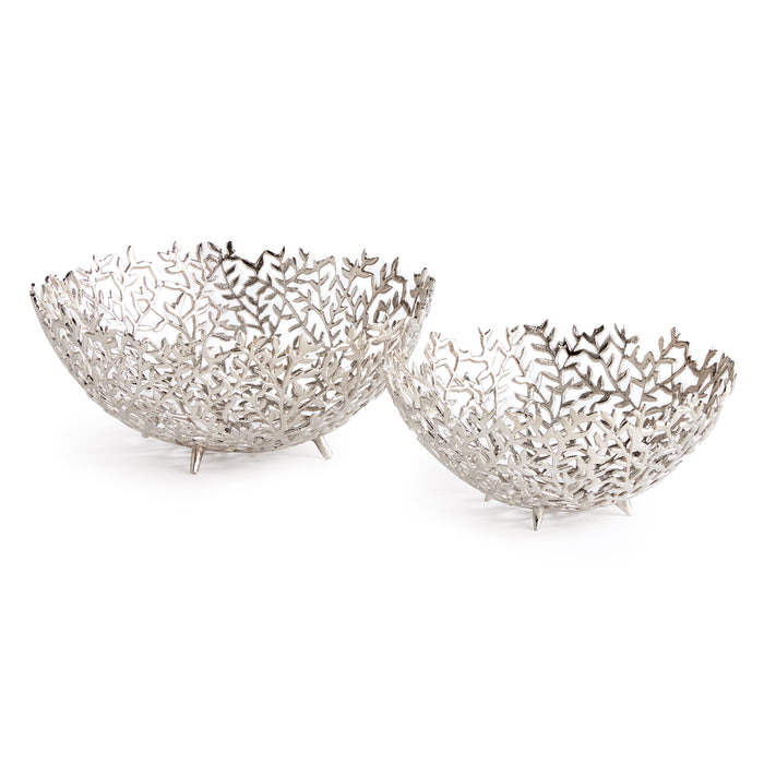 Two silver-toned decorative bowls with cutout leaf pattern, on small legs, set against a white background.