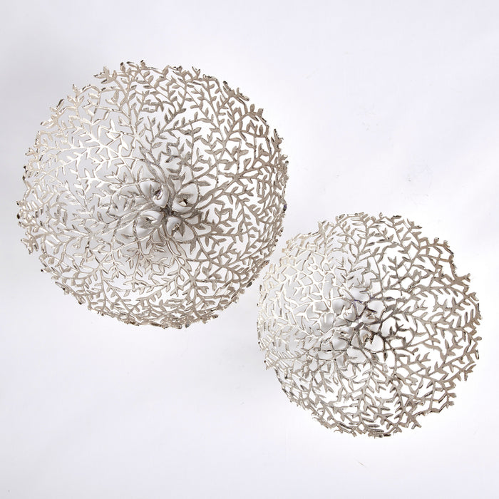 Two decorative silver-toned bowls with open coral-like filigree lace patterns, varying sizes, set on a white background.